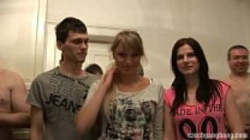 At the Czech Gang Bang, her and her girlfriend are shown affection.
