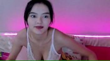 Big tit Asian webcam model Emma clarc, also known as Kelly, masturbates and bounces her oiled tits at the same time.