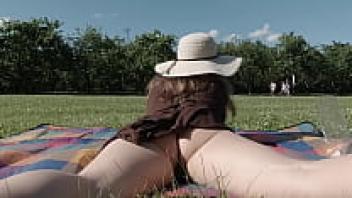 having a laid-back lunch in the park while nude butt. Demonstrating one's breasts and pussy in public.