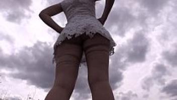 The practice of exhibitionism and fetish throughout outdoor public spaces. A hairy pussy and a big ass are currently strolling along the road. Putting together.