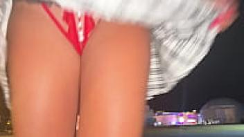 A young woman of 18 years old makes a public display of her pantyhose while dancing.