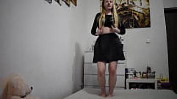 Horny Teen | Miley Grey offers a striptease while wearing a black skirt.