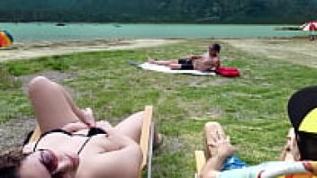 While I am touching myself, Voyeur appears to be masturbating on the beach.