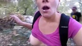 While in a public park, sucking on a big cock