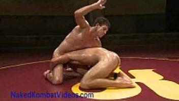 Men with oiled muscles grappling and loving each other