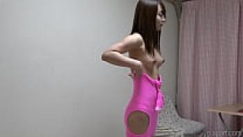 A Japanese woman who is lean and sexy is getting dressed.