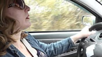 Getting wet in the automobile. Sexy Milf pulls over to the side of the road, masturbates her pussy, and then experiences a powerful wet orgasm. A squirt