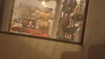 Due to the fact that my step aunt had left the curtains open, I was able to capture her as she was getting dressed after she had taken a shower.