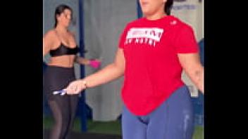 At the gym, the chubby girl was busy jumping rope.