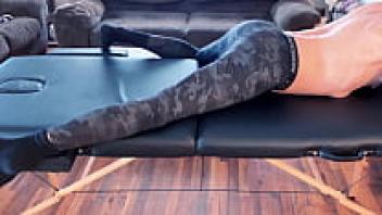 A short version of stretching and compression pants on a massage table in high definition