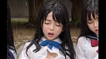 Three Japanese girls squirting in the rain while they are outside
