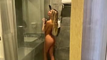 thin girl giving herself a blowjob in the shower