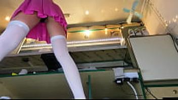 At the workplace, a lovely brunette adolescent wearing a pink skirt and white stockings voyeur upskirt