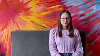With the help of her professor, a Latina college student who wears glasses is able to pass her first-year English class.