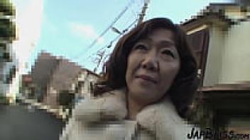 She is a Japanese MILF who is receiving the cum in her pussy.