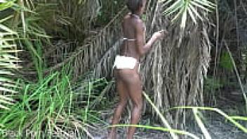 a thin woman from an African tribe who is working outside