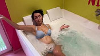 In the jacuzzi, stepson adores his stepmother's hot body.
