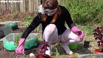 While I was planting flowers, my girlfriend was wearing an upskirt.