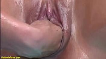 The stepdaughter takes a deep oil fist to the mother.
