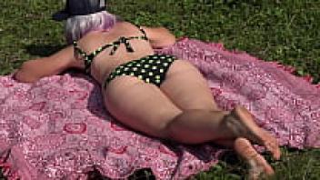 A Voyeur is using a squirt to observe a girl who is masturbating in order to have an orgasmic experience. Excessively large and hairy pussy.