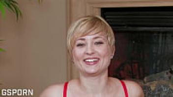 Nora Skyy, a stunning blonde, displays her hairy pussy while masturbating. Check out her!