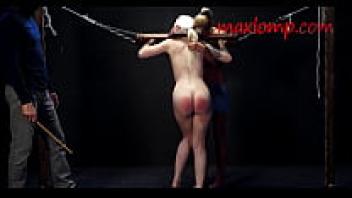 Sadistic perverted guy caning the little ass of a blonde babe