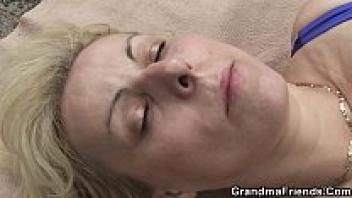 Blonde granny double penetration on the beach.