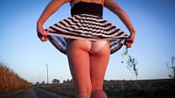 A glimpse of a gorgeous Asian woman wearing an upskirt and flashing panties
