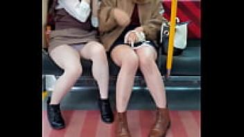 On the train, Japanese cuties are upskirting for you.
