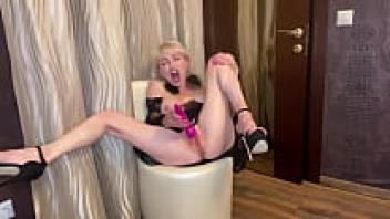 Milf, 45, squirts, spreads her legs wide, and uses a vibrator to arouse her clit.