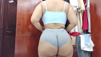 A very large maid flaunts her curves.