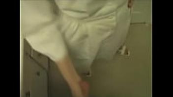 A naughty nurse handjobs the patient.