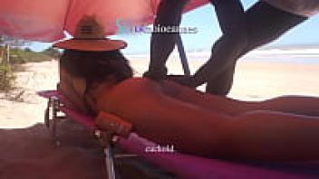 On the beach, Ebony massages a married woman.