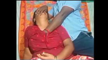 An Indian teacher and pupil share a kiss.