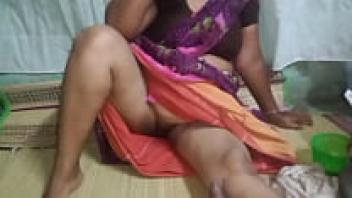With her brother, Aunty Hardcore displays a hairy pussy.