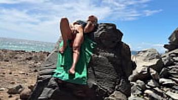 Teen blond with a perfect body having risky sex on a public beach