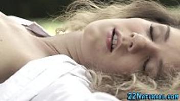 Outside, a babe strokes their clit.