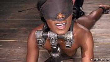 In bondage, Hairy Ebony rides a machine.