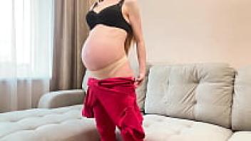 Redhead Stepmom, who is nine months pregnant, best sucks and rides a cock twice.