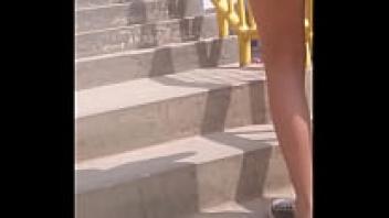 Stair climbing by a little girl wearing a red dress