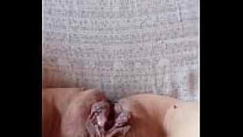 The pregnant wife's hairy pussy is opened.