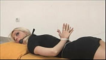 girl with her hands outstretched and hogtied