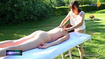 Naked woman receiving a full body massage