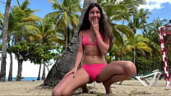 A crazy girl urinating in her underwear on a public beach went to sunbake after wetting her underwear.