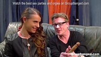 In a gangbang, a gorgeous German milf model enjoys receiving love from everyone.